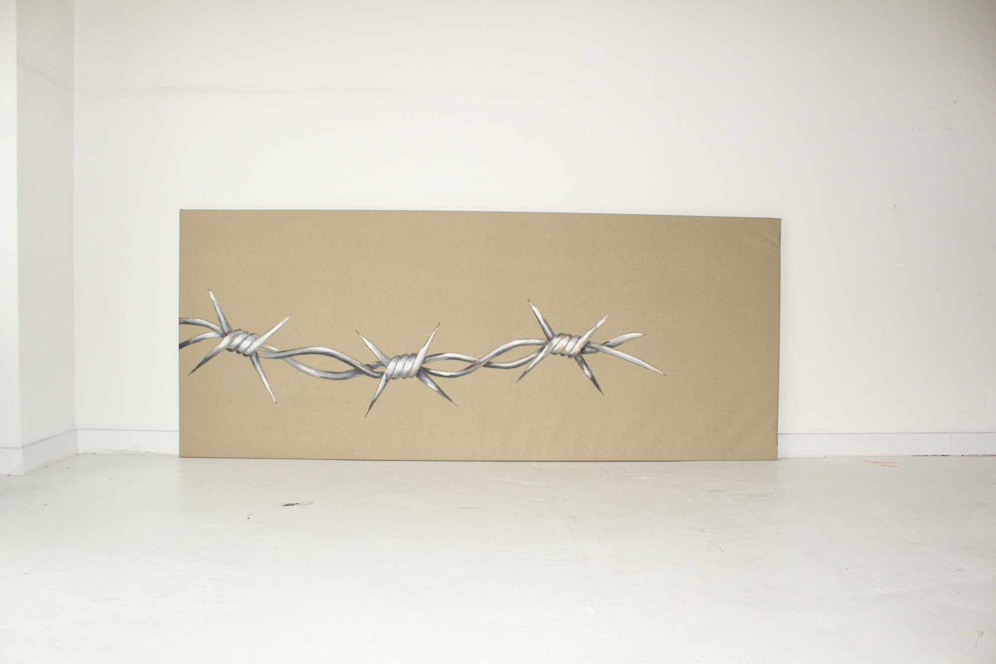 I LOVE YOU: painted barbed wire on an untreated surface, mixed media by Kai Schmidt